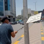 حملة لإزالة الإعلانات المخالفة في حي العجوزة