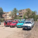 نقل موقف سيارات المسيد والكلالسة بقوص إلى منطقة النفق
